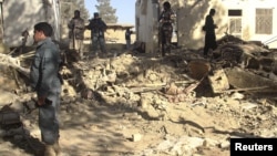 Afghan forces inspect at the site of suicide attack in Spin Boldak district of Kandahar province January 6, 2013. 