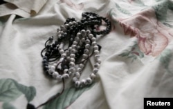 FILE - Prayer beads are shown inside the home of San Bernardino shootings suspects Syed Rizwan Farook and Tashfeen Malik in Redlands, Calif., Dec. 4, 2015,
