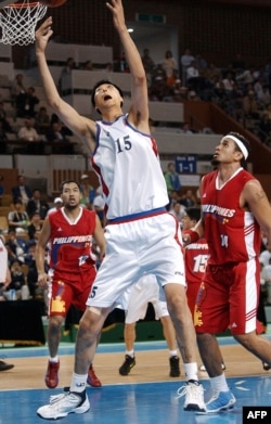 North Korean basketball player Ri Myoung-Hun competes at the 14th Asian Games in Busan, South Korea in Sept. 2002.