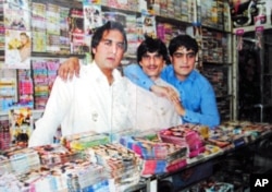 Zenadine, whose music store was recently attacked, now sells mobile phones.