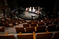 Camera crews prepare for online live during a rehearsal of a Korean traditional music concert at Korea Donhwamun Traditional Theater in Seoul, South Korea, Thursday, March 19, 2020.