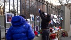 Volunteers with the "Wall of Hope Foundation" build a memorial wall for the victims of New York City's deadliest fire in three decades, in the Bronx borough of New York, Jan. 12, 2022.