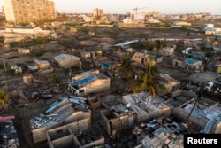 Debris and destroyed buildings which stood in the path of Cyclone Idai can be seen in this aerial photograph over the Praia Nova neighbourhood in Beira on April 1, 2019.