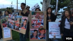 A crowd of Cambodian Americans rally against the visit of Lt. Gen. Hun Manet, Deputy Chairman of Joint Staff in the Royal Cambodian Armed Forces, and the eldest son of Prime Minister Hun Sen, in Long Beach, California, April 9, 2016.