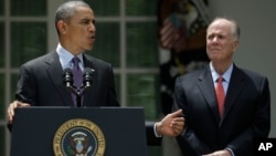 FILE - President Barack Obama, with National Security Advisor Tom Donilon, as he announces his choice for his next National Security Advisor in the Rose Garden of the White House in Washington, June 5, 2013.
