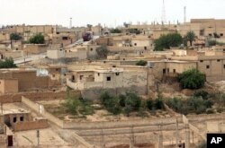 This April 30, 2017 photo provided by the Syrian Democratic Forces, shows a general view of the northern town of Tabqa, Syria.