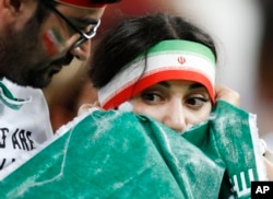 Supporters of Iran react after the end of the group B match between Iran and Portugal at the 2018 soccer World Cup at the Mordovia Arena in Saransk, Russia, June 25, 2018. The game ended 1-1.