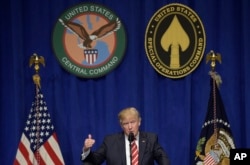 FILE - President Donald Trump speaks to troops while visiting U.S. Central Command and U.S. Special Operations Command at MacDill Air Force Base in Tampa, Florida, Feb. 6, 2017.