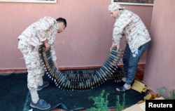 Members of Misrata forces, under the protection of Tripoli's forces, prepare themselves to go to the front line in Tripoli, Libya April 9, 2019.