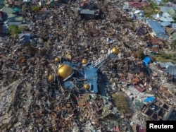 An aerial view of an area devastated by an earthquake in Palu, Central Sulawesi, Indonesia October 1, 2018 in this photo taken by Antara Foto.