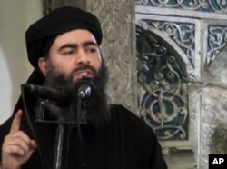 FILE - This image taken from a militant website July 5, 2014, purports to show the leader of the Islamic State group, Abu Bakr al-Baghdadi, who released a message encouraging his followers to keep up the fight for the city of Mosul.
