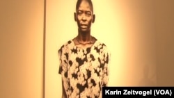 The only woman in the series of photographs that make up "Life and Death" by US photographer Tim Freccia.