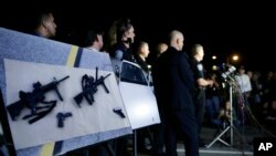 Police crime photos are displayed during a Dec. 4 press conference in San Bernardino, Calif.