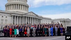 Members of the freshman class of Congress pose for a photo on Capitol Hill in Washington, Nov. 14, 2018, in Washington.
