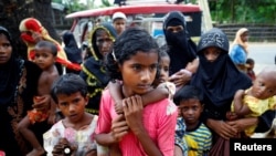 FILE - Rohingya refugees arrive near the Kutupalang makeshift Refugee Camp, in Cox’s Bazar, Bangladesh, Aug. 29, 2017.