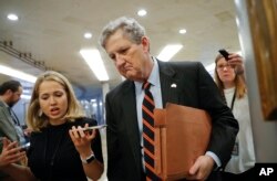 Sen. John Kennedy, R-La., arrives at the Capitol in Washington, Oct. 4, 2018.
