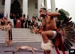 Chickahominy Indian Preston Adkins preforms a ritual dance for Va. Gov. Jim Gilmore, during the annual tax tribute at the Capitol in Richmond, Va., Wednesday Nov. 24, 1999. Virginia Indian tribes have been paying the annual tax tribute since the treaty of