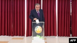 FILE - Tajikistan's President Emomali Rahmon casts his ballot at a polling station during parliamentary elections in Dushanbe, March 2, 2025, in this handout photograph taken and released by the Tajik Presidential Press Service.