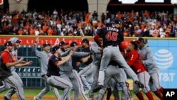 The Washington Nationals celebrate after winning Game 7 of the baseball World Series against the Houston Astros, Oct. 30, 2019, in Houston. The Nationals won 6-2 to win the series.