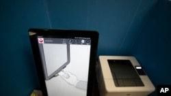 FILE- In this Sept. 16, 2019 file photo, the Dominion Voting system Georgia will use is shown in Atlanta.