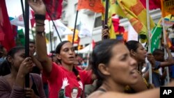 Government supporters march during an anti-imperialist rally in Caracas, Venezuela, Saturday, March 30, 2019. 
