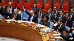 Ambassadors to the United Nations raise hands in a Security Council resolution vote to sanction North Korea at U.N. headquarters in New York, June 2, 2017.