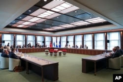 FILE - Delegations from Sweden, Turkey, Finland and NATO gather in Ankara, Turkey, on June 14, 2023. The NATO alliance was pressing Turkey to move ahead with the ratification of Sweden's application to join the military bloc. (Turkish Presidency via AP)