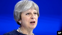 British Prime Minister Theresa May delivers a speech during the annual meeting of the World Economic Forum in Davos, Switzerland, Jan. 25, 2018.