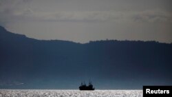 FILE - Chinese fishing trawlers anchor off the coast of Freetown, Sierra Leone.