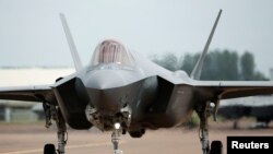 FILE - A Lockheed Martin F-35A fighter taxis along a runway at the Royal International Air Tattoo at Fairford, Britain July 8, 2016. 