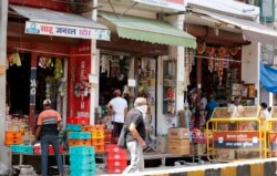 Small grocery shops are seen reopened amid the coronavirus pandemic, in Prayagraj, India, April 25, 2020.