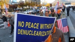 Protesters march toward the U.S. Embassy during a rally supporting the United States' policy to put steady pressure on North Korea in Seoul, South Korea, Nov. 3, 2018.