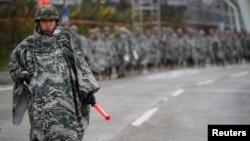 FILE - South Korean marines march during a military exercise as a part of the annual joint military training called Foal Eagle between South Korea and the U.S. in Pohang, South Korea, April 5, 2018. 