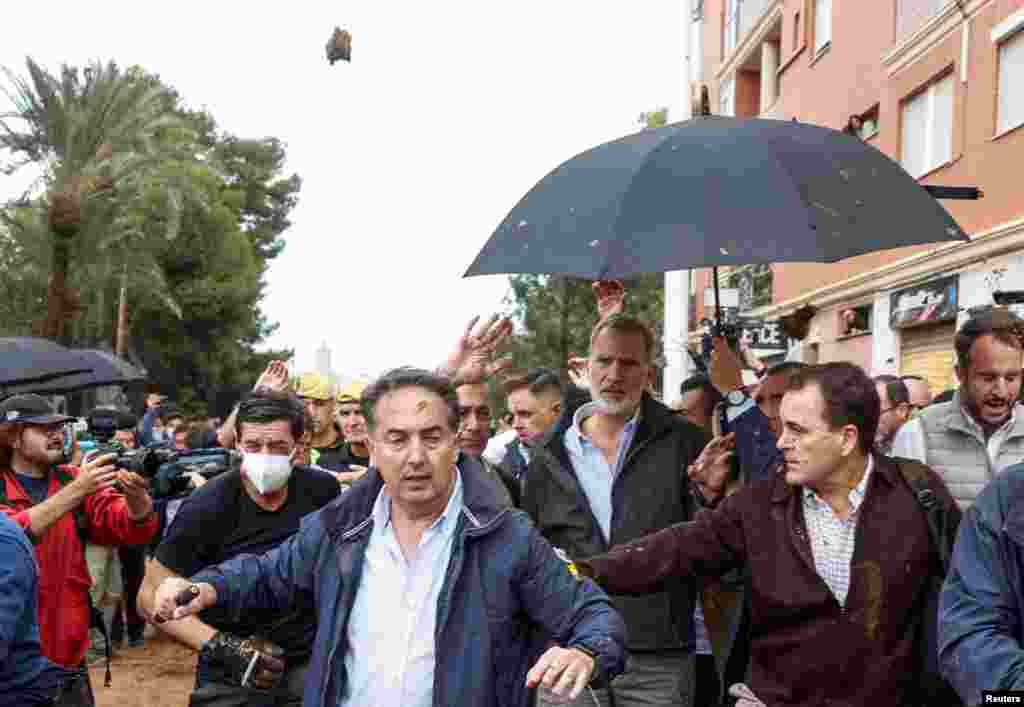People throw mud at Spain's King Felipe he visits Paiporta, near Valencia, following heavy rains that caused floods.