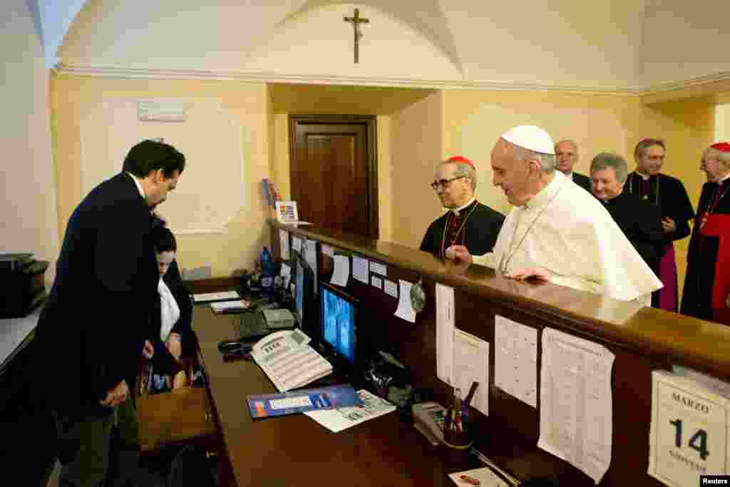 Pope Francis checks out of the church-run residence where he had been staying in Rome before becoming pontiff, March, 14, 2013. (Osservatore Romano)