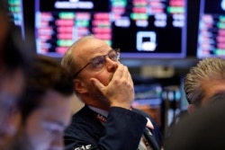 Trader David O'Day works on the floor of the New York Stock Exchange, Feb. 28, 2020.