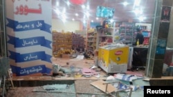 A damaged storefront is seen after an earthquake in Halabja, Iraq, Nov. 12, 2017. Twitter - Osama Golpy/Rudaw/Social Media/via Reuters