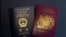 A British National Overseas passports (BNO) and a Hong Kong Special Administrative Region of the People's Republic of China passport are pictured in Hong Kong, Friday, Jan. 29, 2021. 