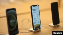 FILE - iPhone 12 phones are seen at an Apple Store in Los Angeles, June 24, 2021.