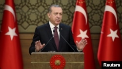 Tayyip Erdogan addresses a gathering of local leaders in Ankara, Turkey, Dec. 1, 2016.