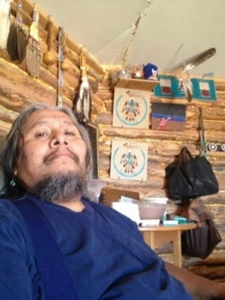 Undated photo shows Fred "Uncle Fred" Willie, a citizen of the Navajo Nation, inside his home, a traditional hogan near Tuba City, Arizona.