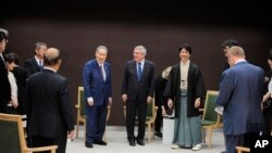 International Olympic Committee (IOC) President Thomas Bach, center right, and Tokyo 2020 President Yoshiro Mori, center left, attend a round-table discussion with the Tokyo 2020 Opening and Closing Ceremony creative team in Tokyo Wed., July 24, 2019.
