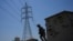 FILE - Members of the Iraqi army secure main power lines between regional towers in Baghdad, Iraq, Aug. 8, 2023.