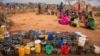 FILE - People wait for food and water in the Warder district in the Somali region of Ethiopia, Jan. 28, 2017.