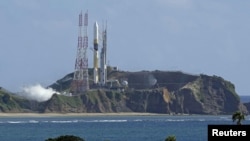 H2-A launch vehicle number 47 is seen on the launching pad at Tanegashima Space Center on the southwestern island of Tanegashima, Japan in this photo taken by Kyodo on Aug. 28, 2023. Kyodo/via REUTERS 