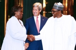 FILE - United States Secretary of State John Kerry, center, reacts as Nigerian President Muhammadu Buhari shakes hands with Assistant Secretary of State for Africa Linda Thomas-Greenfield at the presidential villa in Abuja, Aug. 23, 2016.