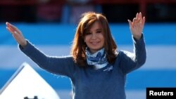 FILE - Former Argentine President Cristina Fernandez de Kirchner waves during a rally in Buenos Aires, June 20, 2017.