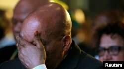 FILE - South Africa's President Jacob Zuma reacts during the official announcement of the munincipal election results at the result center in Pretoria, South Africa, Aug. 6, 2016. 