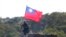FILE - A soldier holds a Taiwanese flag during a military exercise aimed at repelling an attack from China in Hsinchu County, northern Taiwan, Jan. 19, 2021. 