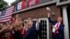 Former President Donald Trump throws a football to the crowd during a visit to Iowa State University before a football game between Iowa State and the University of Iowa, Sept. 9, 2023, in Ames, Iowa.